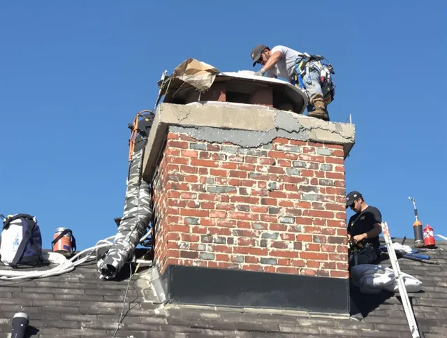 Clearwater Chimney Sweep installing a custom chimney crown in Clearwater, FL