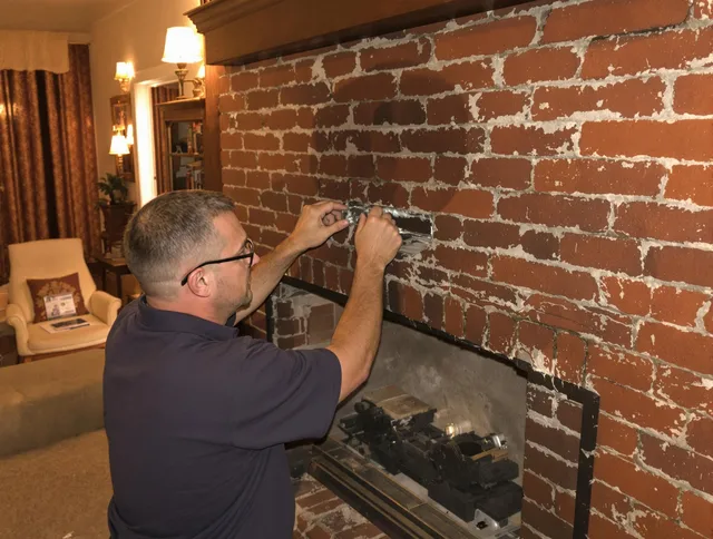 Clearwater Chimney Sweep expert fixing a fireplace in Clearwater, FL